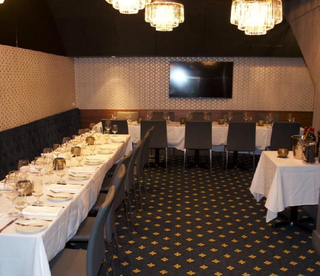 A beautifully arranged private dining room at Brix & Mortar restaurant in Vancouver, featuring an elegantly set table.