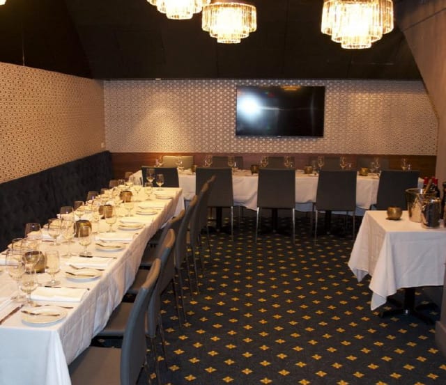 event-space02 A beautifully arranged private dining room at Brix & Mortar restaurant in Vancouver, featuring an elegantly set table.